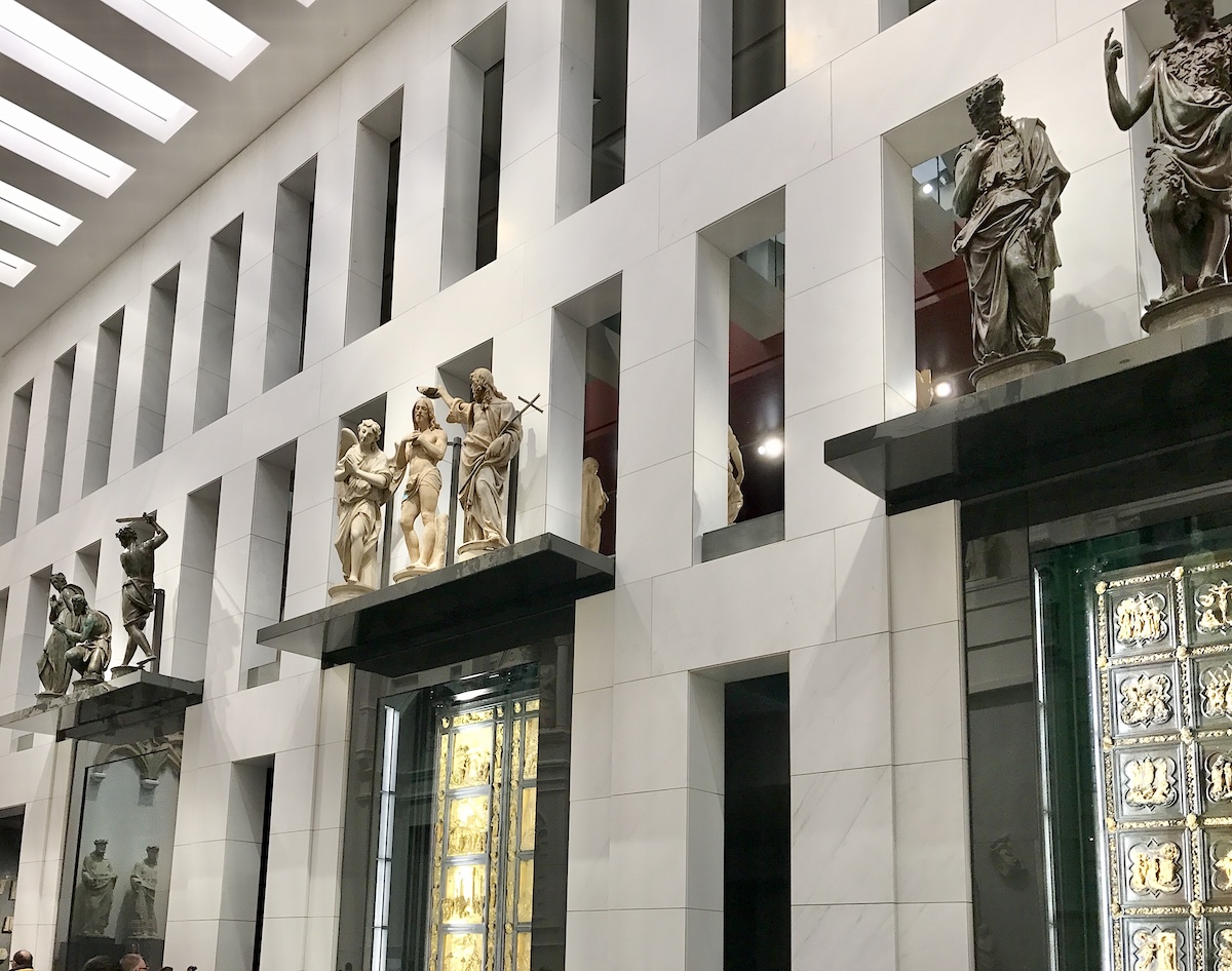 Ghiberti's Gates of Paradise and North Doors in the museum's Sala del Paradiso, beneath the original sculpture groups that once stood above the Baptistery's doorways.