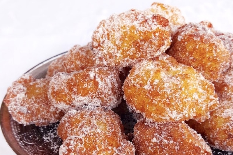 A plate of frittelle di riso, a traditional dish for the Festa di San Giuseppe A plate of frittelle di riso, a traditional dish for the Festa di San Giuseppe