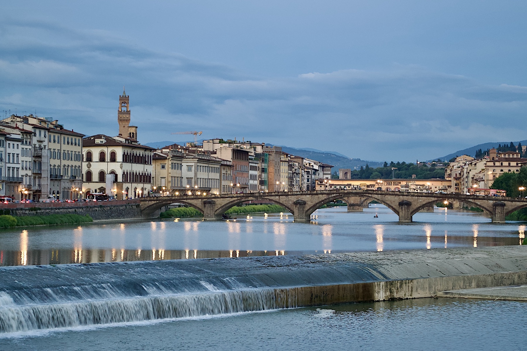 The Pescaia di Santa Rosa weir at dusk looking east from the Ponte Amerigo Vespucci towards the Ponte alla Carraia